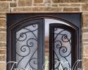 This beautiful front entrance features stand out doors to set this home apart that Tracie J. Kelley designed.