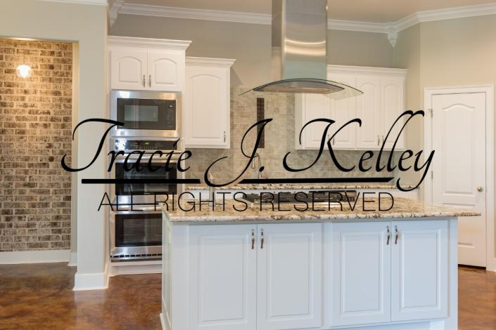 A great kitchen by Tracie J Kelley that features a beautiful island with plenty of storage as well.
